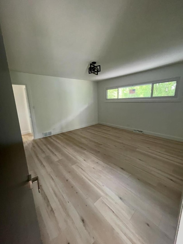 spare room with light wood-type flooring