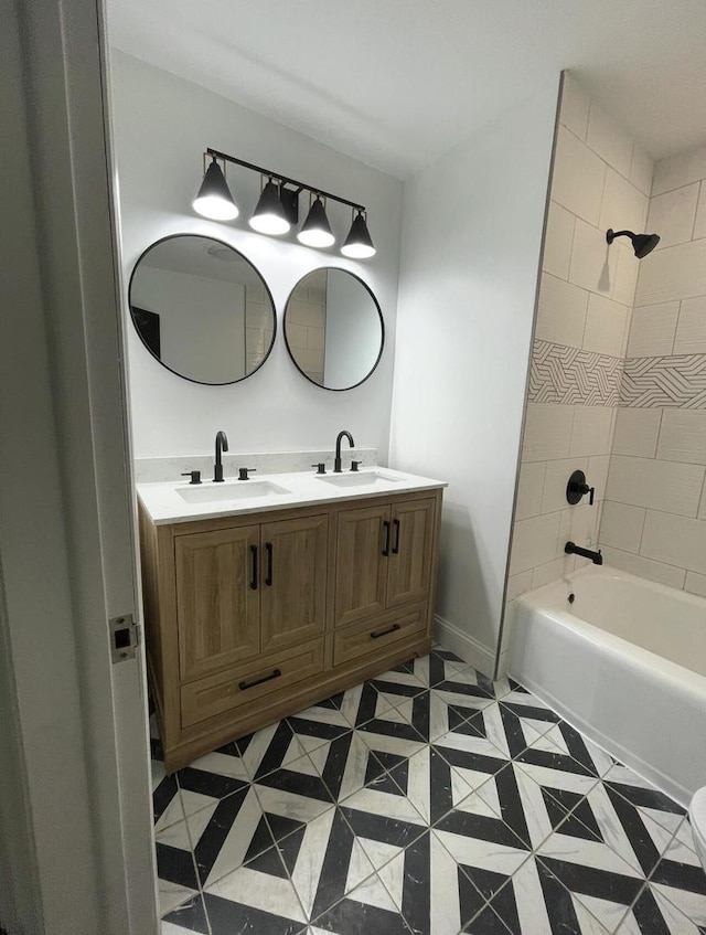 bathroom with vanity, tile patterned floors, and tiled shower / bath