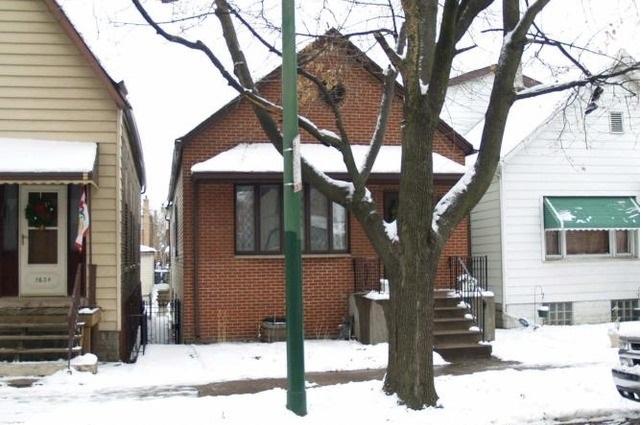 exterior space featuring brick siding