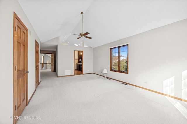 empty room with light carpet, lofted ceiling, and ceiling fan