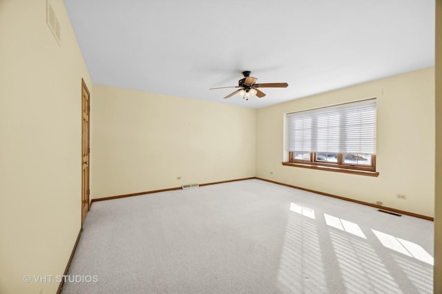 carpeted empty room featuring ceiling fan