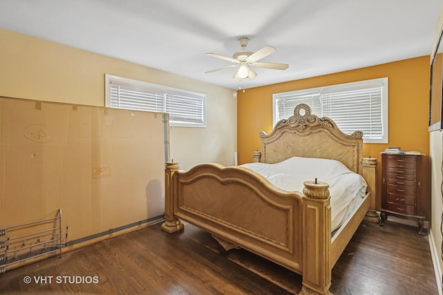 bedroom featuring ceiling fan and dark hardwood / wood-style flooring