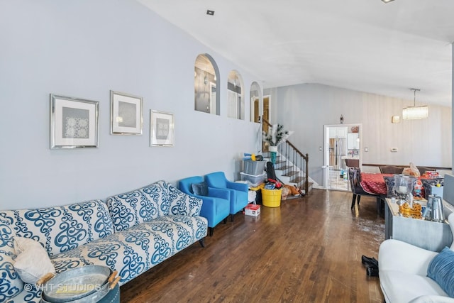 living room featuring vaulted ceiling and dark hardwood / wood-style flooring