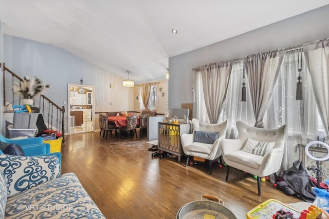 living room with vaulted ceiling and hardwood / wood-style floors