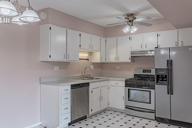 kitchen with pendant lighting, sink, ceiling fan, appliances with stainless steel finishes, and white cabinets