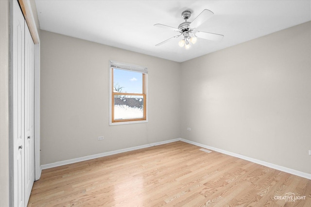 unfurnished bedroom with a closet, ceiling fan, and light wood-type flooring