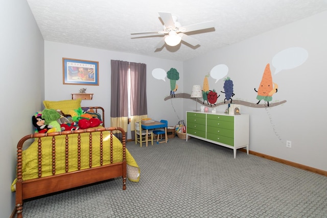 carpeted bedroom with baseboards, a textured ceiling, and ceiling fan