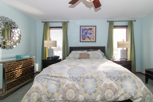 bedroom featuring baseboards, carpet floors, and a ceiling fan