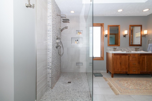 full bath featuring tile patterned floors, a sink, recessed lighting, double vanity, and walk in shower