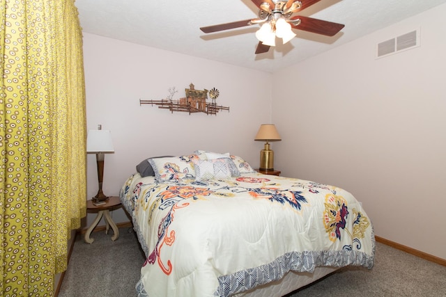 carpeted bedroom featuring visible vents, ceiling fan, and baseboards