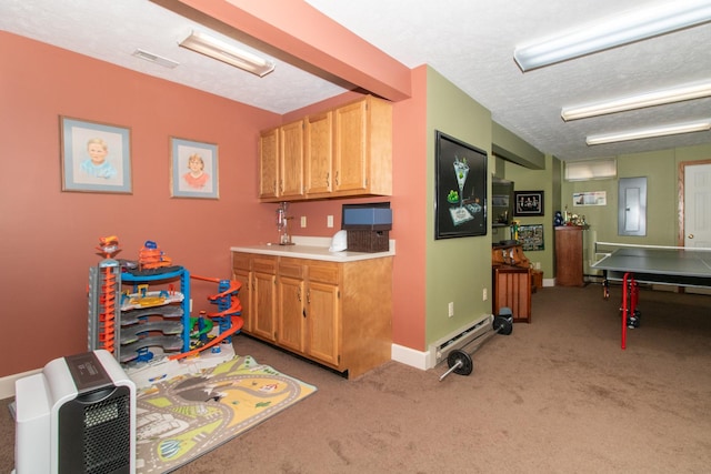 interior space featuring visible vents, light carpet, electric panel, a textured ceiling, and light countertops