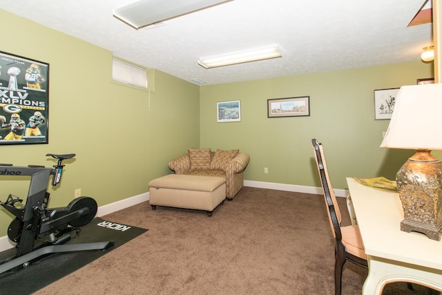 exercise room featuring carpet flooring and baseboards