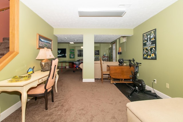 carpeted office space with visible vents, a textured ceiling, and baseboards