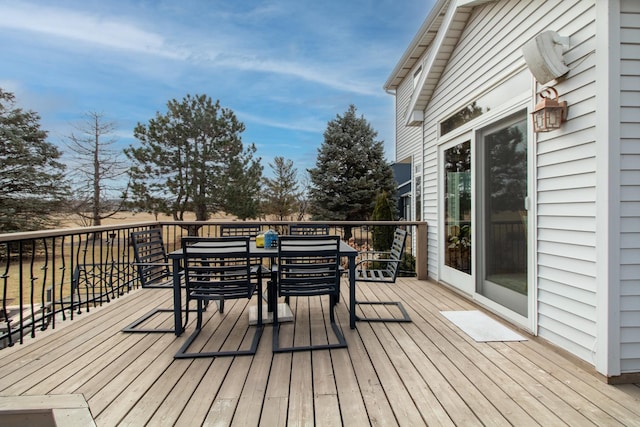 deck with outdoor dining area