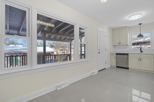 kitchen with sink, decorative light fixtures, and dishwasher