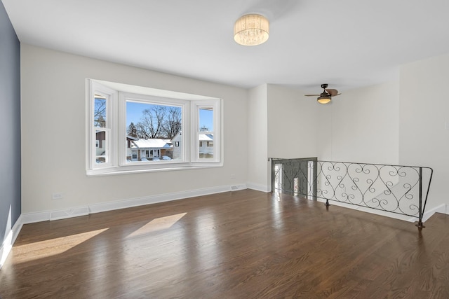 empty room featuring dark hardwood / wood-style floors