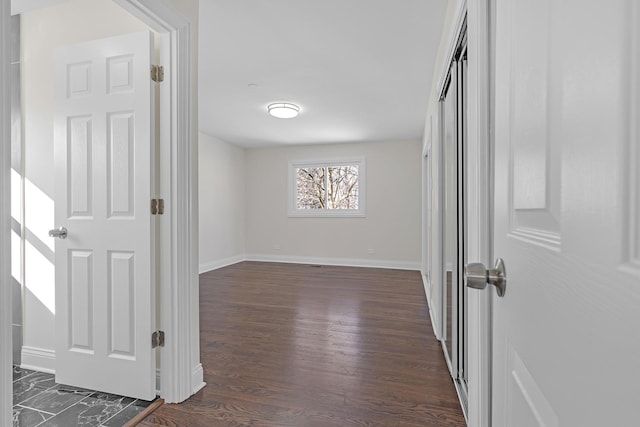 empty room featuring dark wood-type flooring