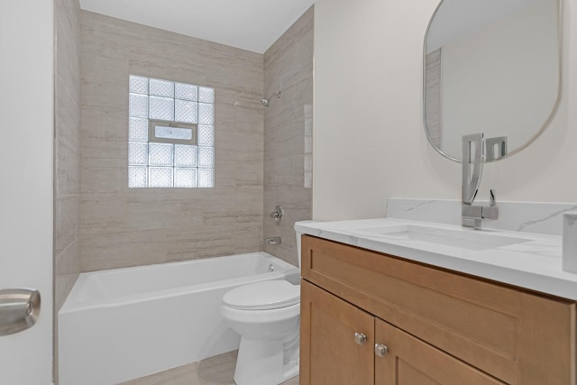 full bathroom featuring vanity, toilet, and tiled shower / bath