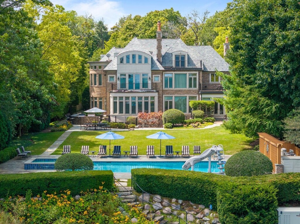 765 Sheridan Rd, Winnetka, IL 60093 - back of property featuring an outdoor pool, a lawn, and a patio