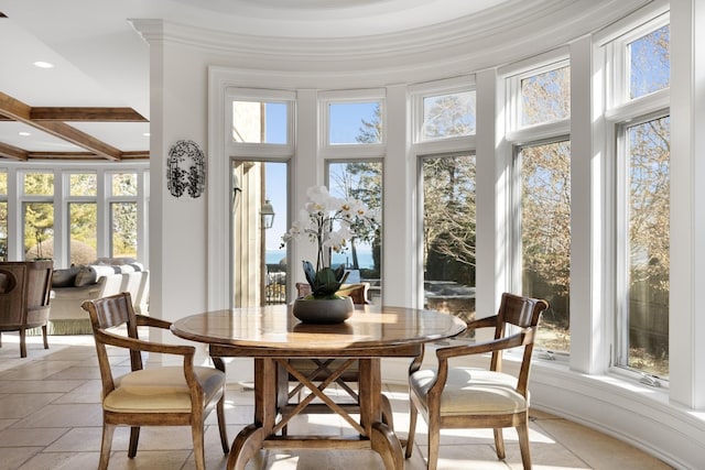 sunroom / solarium featuring a wealth of natural light, beam ceiling, and coffered ceiling