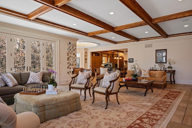 living room with beam ceiling, coffered ceiling, visible vents, and baseboards