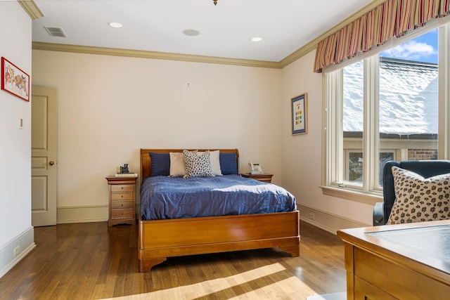 bedroom with recessed lighting, wood finished floors, visible vents, baseboards, and ornamental molding