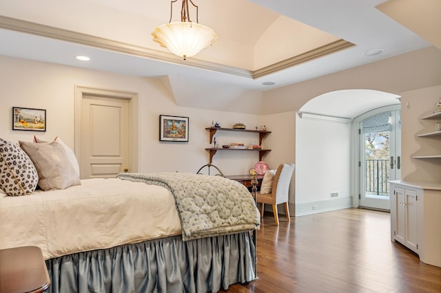 bedroom featuring arched walkways, recessed lighting, dark wood-style flooring, baseboards, and access to outside