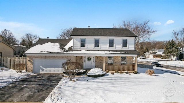 front of property featuring a garage and a porch