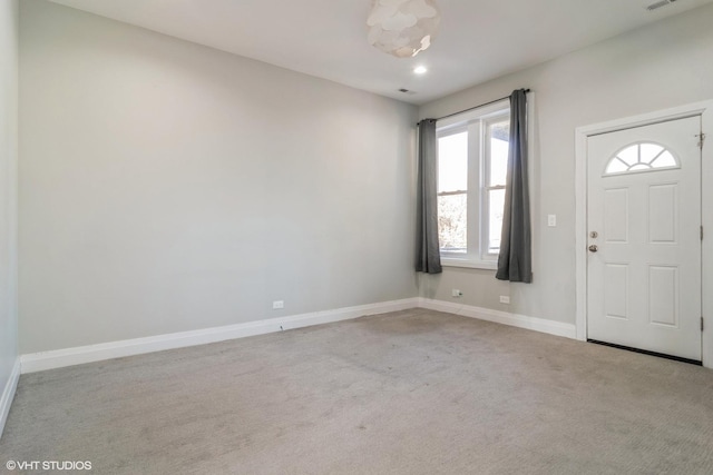 view of carpeted foyer