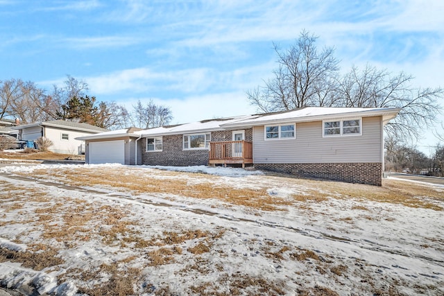 view of front of house with a garage and a wooden deck