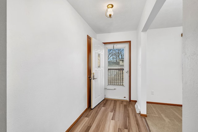 doorway to outside featuring light hardwood / wood-style floors