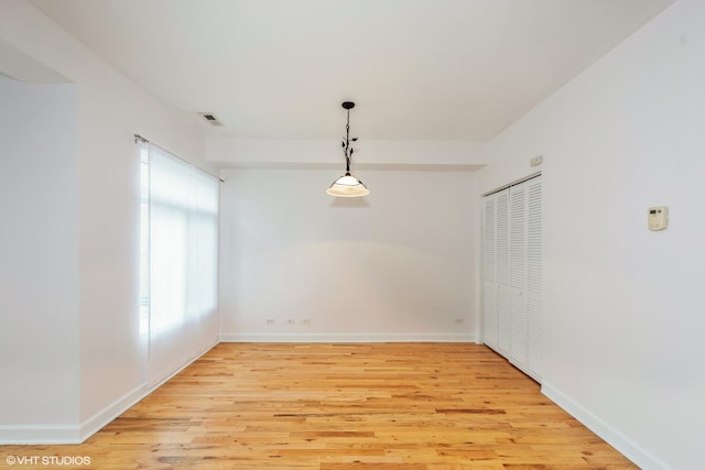 spare room with light hardwood / wood-style floors