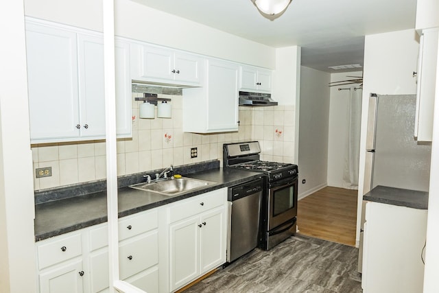 kitchen featuring white cabinetry, sink, extractor fan, and appliances with stainless steel finishes