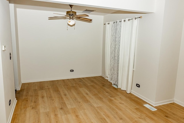 unfurnished room featuring ceiling fan and light hardwood / wood-style floors