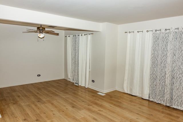 spare room with ceiling fan and light hardwood / wood-style floors