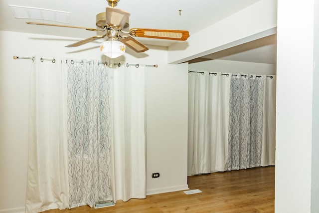 bathroom featuring wood-type flooring and ceiling fan