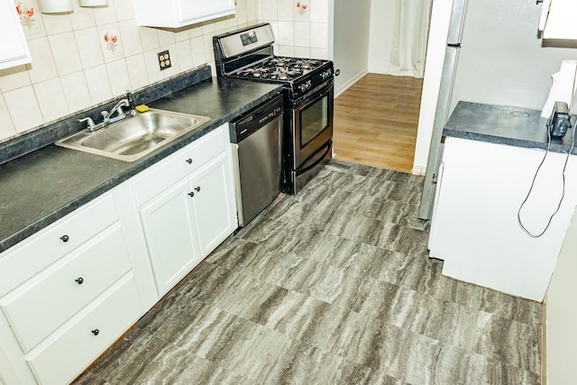 kitchen with backsplash, appliances with stainless steel finishes, sink, and white cabinets