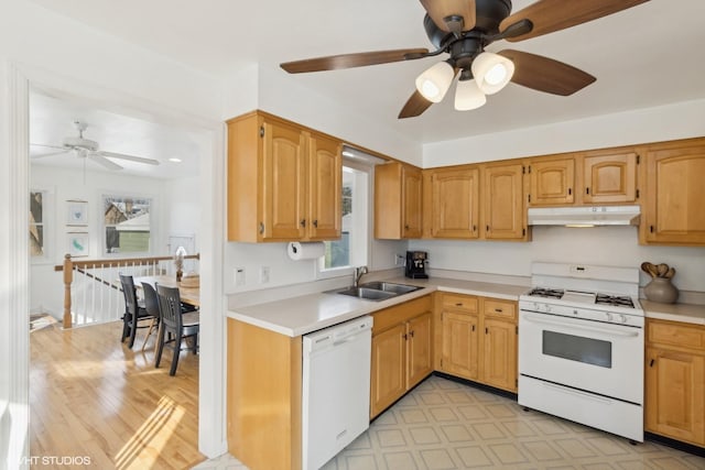 kitchen featuring white appliances, ceiling fan, and sink