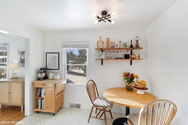 dining area with a chandelier