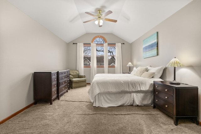 bedroom featuring lofted ceiling, light carpet, baseboards, and a ceiling fan