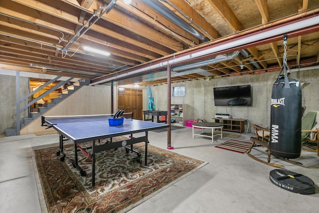 recreation room with concrete flooring