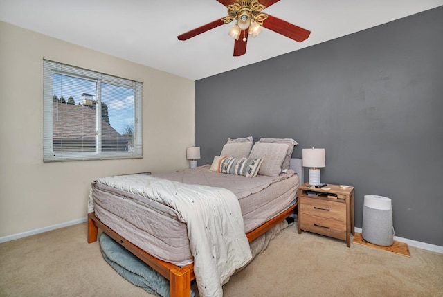 bedroom with ceiling fan and light colored carpet