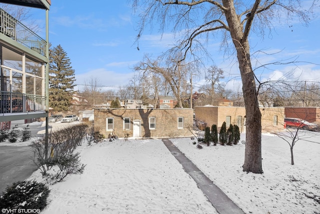 view of yard layered in snow