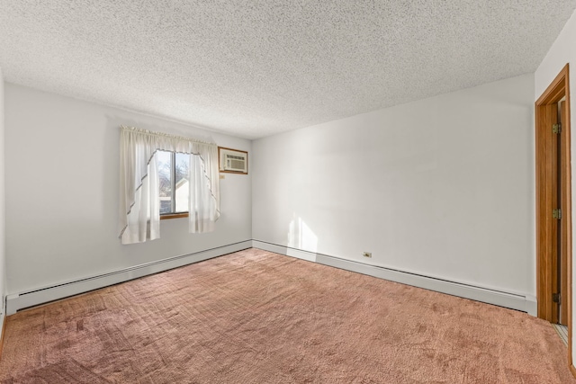 carpeted spare room featuring a wall mounted air conditioner, baseboard heating, and a textured ceiling