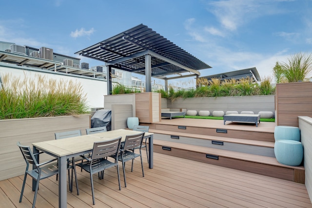 wooden deck featuring outdoor dining area, area for grilling, and a pergola