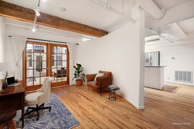 office featuring visible vents, light wood-style floors, french doors, beamed ceiling, and rail lighting