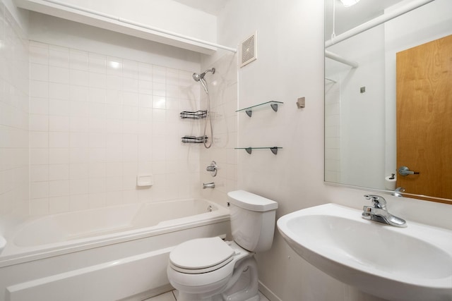 full bath featuring toilet, visible vents, a sink, and shower / tub combination