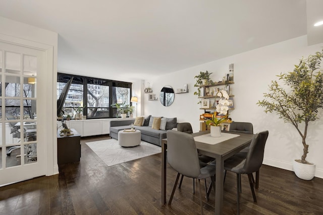 dining space featuring dark wood-type flooring