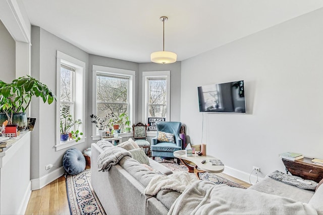 living room with light wood-style floors and baseboards