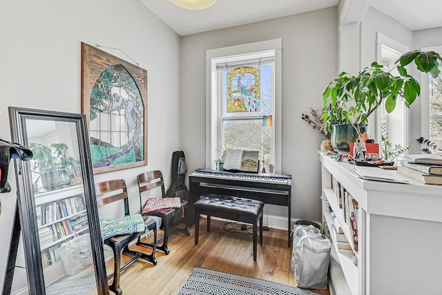 sitting room with light wood finished floors and baseboards